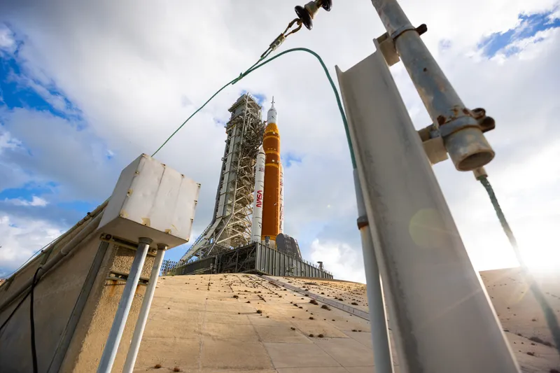 The SLS rocket on Launch Pad 39B, seen from low beside the pad structures