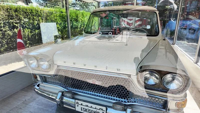 The Devrim car on display behind glass
