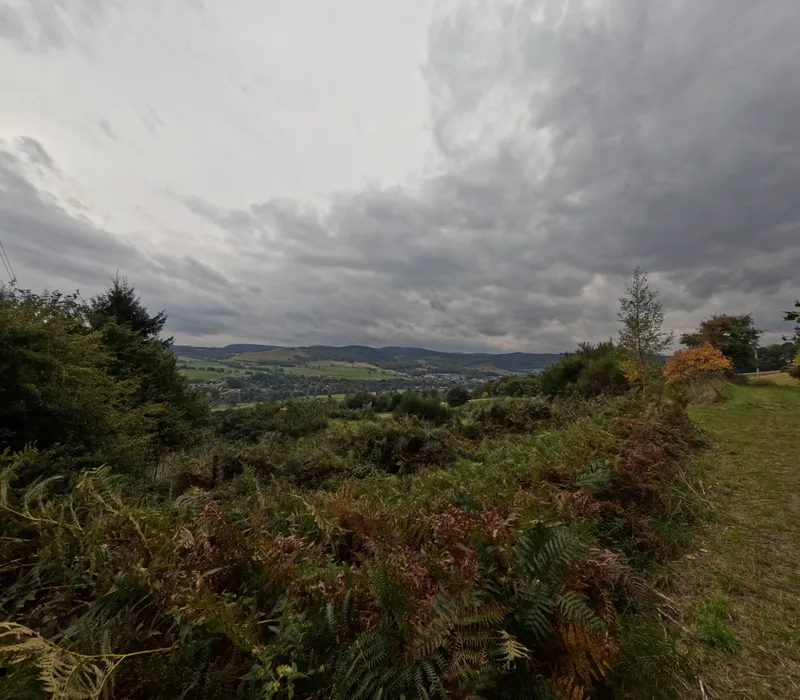 A green valley near Aberfeldy under a cloudy sky