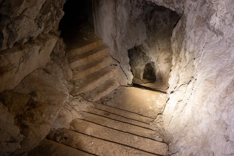 Stone steps leading down into a cavern