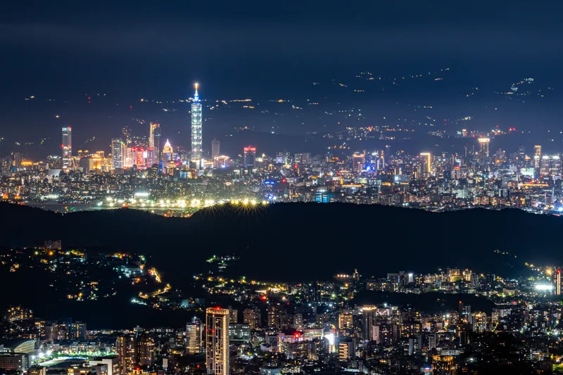 Taipei at night with Taipei 101 lit up, seen from the hills