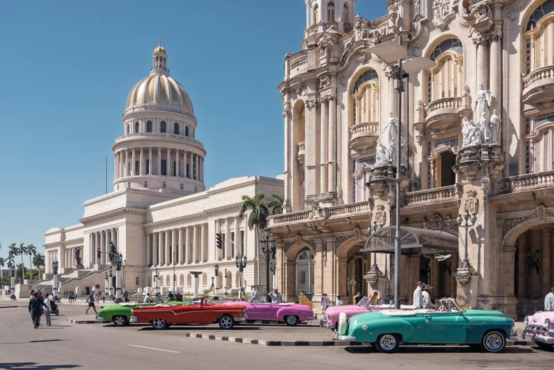 The National Capitol in Havana with classic cars parked in front