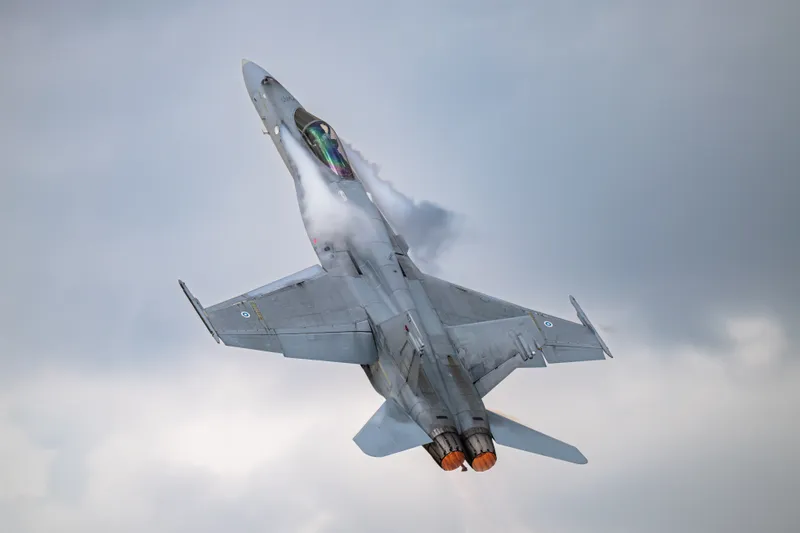 A Finnish Air Force F/A-18C Hornet climbing steeply at an air show