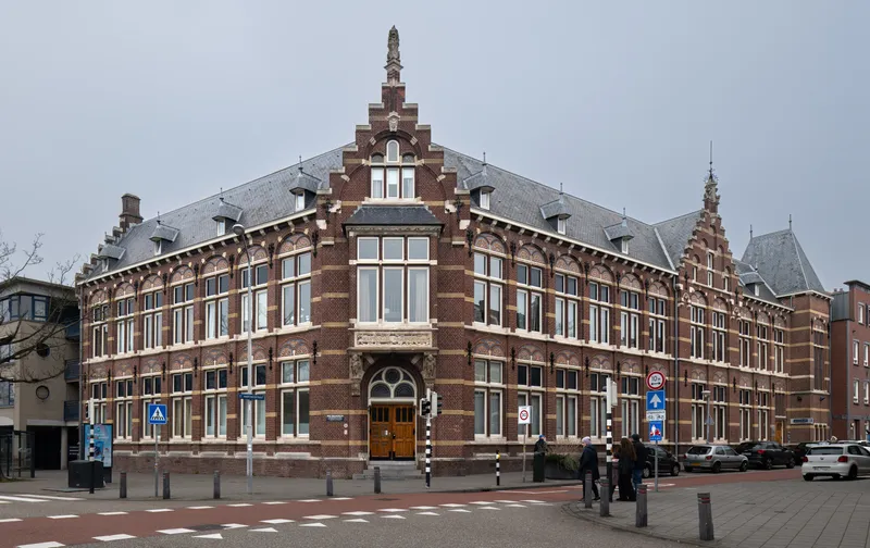 A red-brick former school building on a square in Venlo