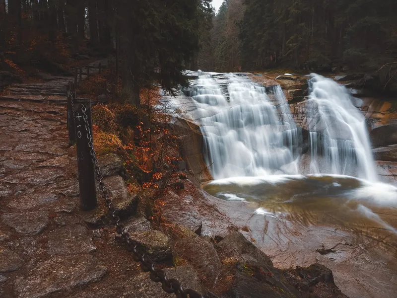 The Mumlava waterfall flowing over rocks