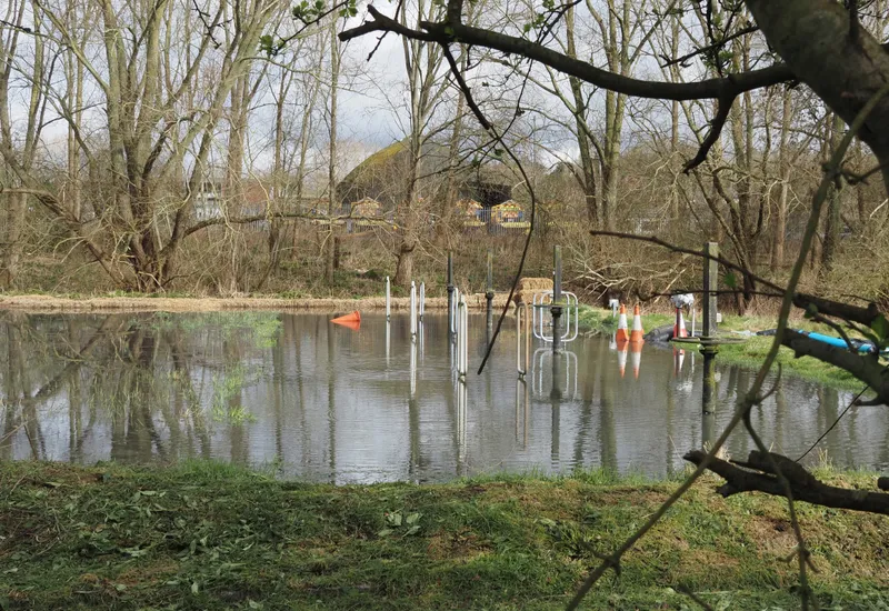 A flooded pond among bare trees near Amersham