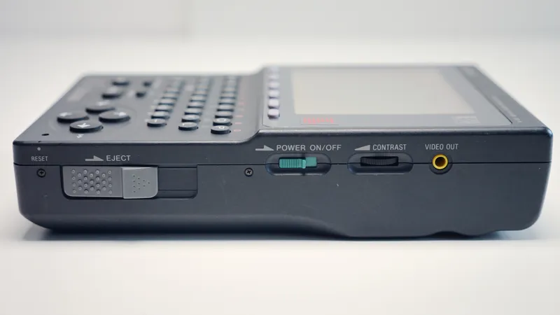 Side view of a Sony Data Discman electronic book player on a white background