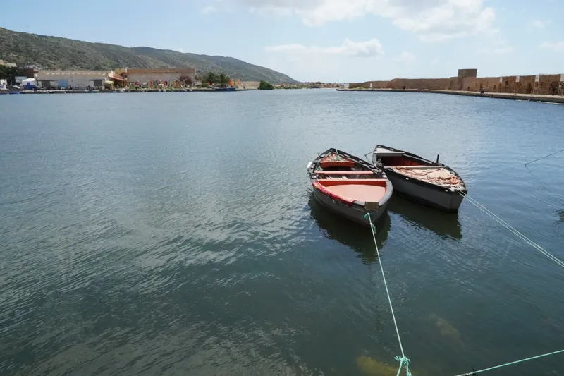 Two rowing boats moored in the Punic port of Ghar El Melh