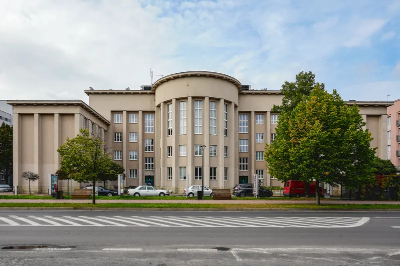 The modernist facade of Sosnowiec City Hall, with a pedestrian crossing in front