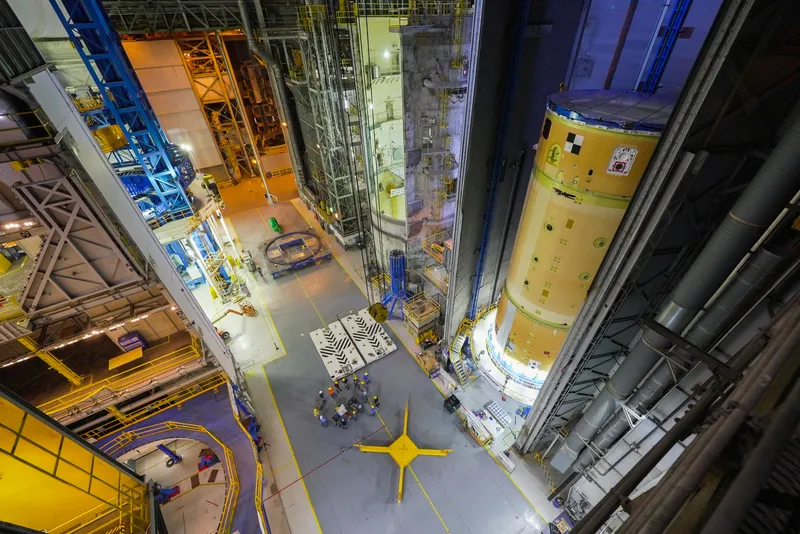Rocket core stage sections in a tall assembly hall at NASA Michoud