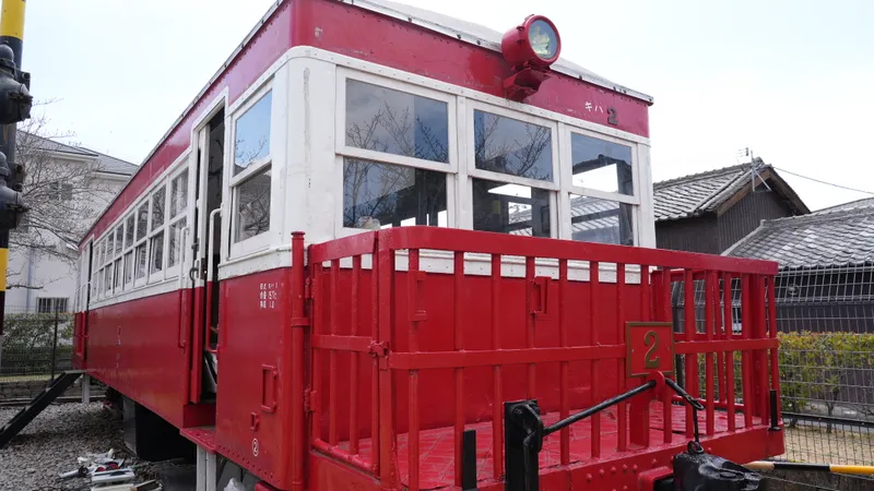 A red-and-cream vintage railcar on display